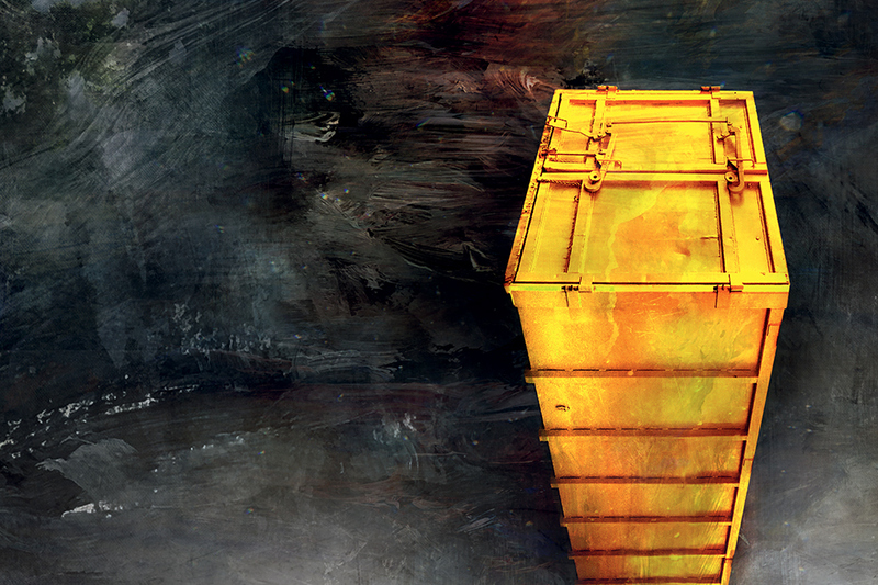 En svart bakgrund och en gul container syns på bilden 